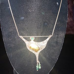 Silver and Gold Pendent with raw Emeralds.